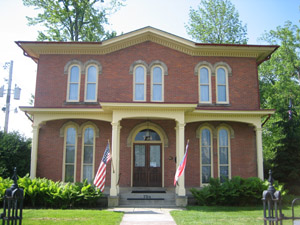 The Monroe House (1866) is one of the Heritage Center's three historic buildings and includes the main office.